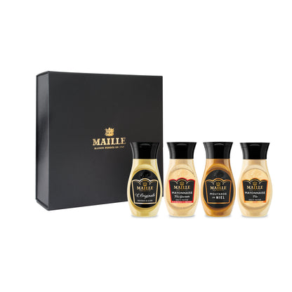 Coffret cadeau Maille composé de quatre sauces et condiments gourmands, dont mayonnaise, moutarde au miel et vinaigrette, présenté dans un élégant écrin noir.