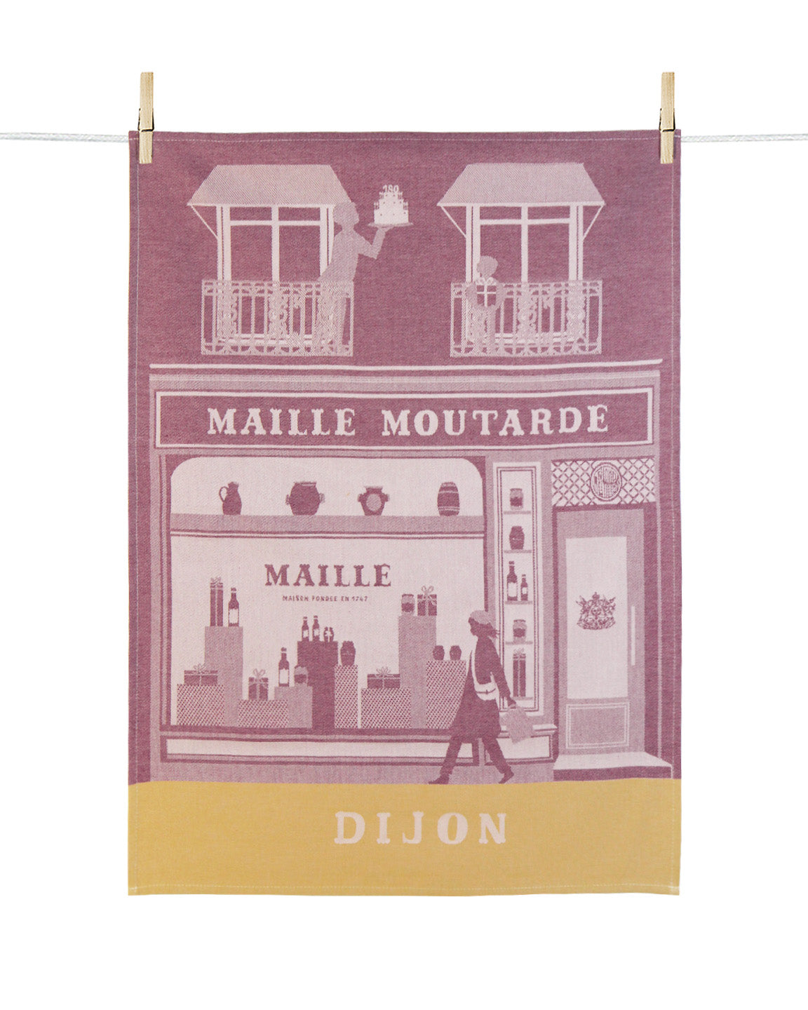 Torchon de cuisine Maille Dijon en coton jacquard rose poudré et jaune moutarde, illustrant la façade emblématique de la boutique Maille Moutarde à Dijon.