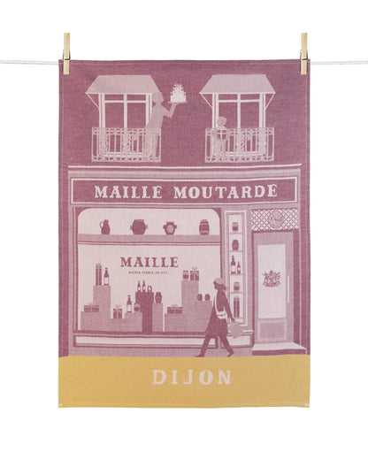 Torchon de cuisine Maille Dijon en coton jacquard rose poudré et jaune moutarde, illustrant la façade emblématique de la boutique Maille Moutarde à Dijon.