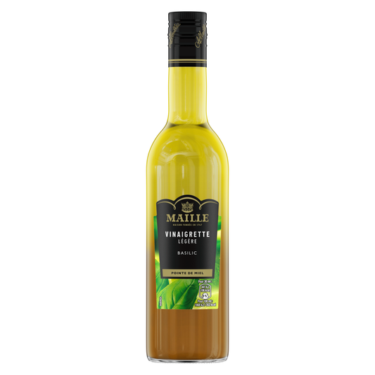 Vinaigrette légère Maille au basilic avec pointe de miel, présentée dans une bouteille en verre de 36 cl. La vinaigrette bicolore aux teintes dorées et ambrées est visible à travers la bouteille. L’étiquette noire et dorée met en avant les saveurs basilic et miel, illustrées par des feuilles de basilic vertes. Produit photographié sur fond blanc.