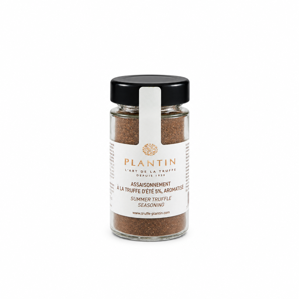 Flacon d’assaisonnement à la truffe d’été Plantin contenant 5 % de truffe d’été aromatisée. Présenté dans un pot en verre avec couvercle noir et étiquette blanche, sur fond clair.