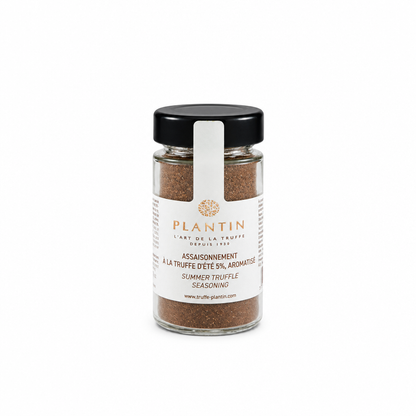 Flacon d’assaisonnement à la truffe d’été Plantin contenant 5 % de truffe d’été aromatisée. Présenté dans un pot en verre avec couvercle noir et étiquette blanche, sur fond clair.