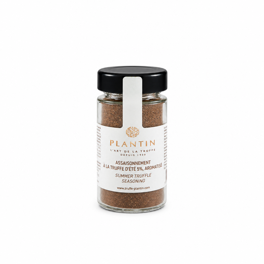 Flacon d’assaisonnement à la truffe d’été Plantin contenant 5 % de truffe d’été aromatisée. Présenté dans un pot en verre avec couvercle noir et étiquette blanche, sur fond clair.