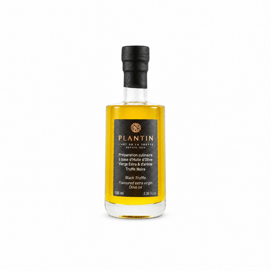Bouteille de préparation culinaire Plantin à base d’huile d’olive vierge extra et d’arôme de truffe noire, format 100 ml. Présentée sur fond clair, la bouteille en verre met en valeur la couleur dorée de l’huile et l’étiquette noire signature de la Maison Plantin.