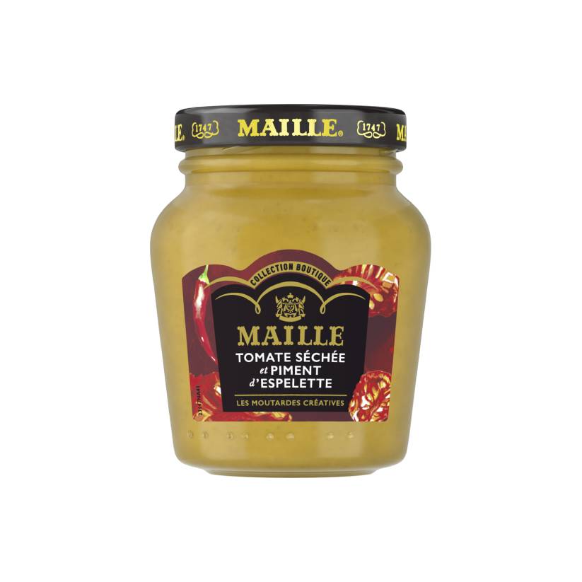 Moutarde Maille Tomate Séchée et Piment d'Espelette en pot en verre. Cette moutarde créative de la Collection Boutique Maille est présentée avec une étiquette aux accents rouges évoquant les tomates séchées et le piment d'Espelette.